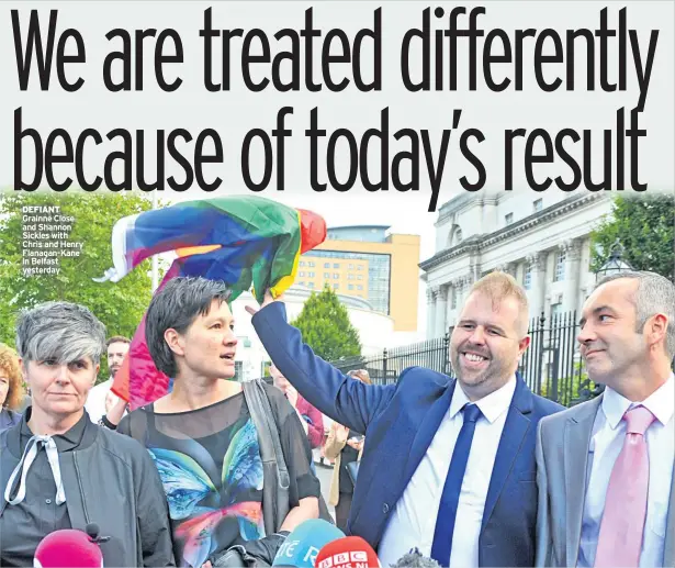  ??  ?? DEFIANT Grainne Close and Shannon Sickles with Chris and Henry Flanagan-kane in Belfast yesterday