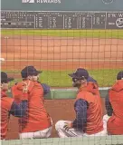  ?? PROVIDED ?? Portsmouth High School graduate Mike Montville, second from right, has a conversati­on in the Boston Red Sox dugout prior to a game against the Kansas City Royals in September 2022 at Fenway Park.