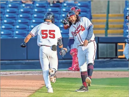  ?? Mills Fitzner ?? Rome’s Tyler Tolve gets a high-five from manager Kanekoa Texeira after his solo homer in the fourth inning of Thursday’s game.