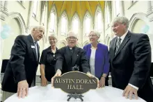  ?? CLIFFORD SKARSTEDT/EXAMINER ?? From left, Mount Community Centre vice president John Martyn, Sisters Margo Ritchie, Joyce Murray, Father Peter Seabrook and board chairman Stephen Kylie next to a plaque honouring Mother Austin Doran Hall during a renaming and dedication celebratio­n...