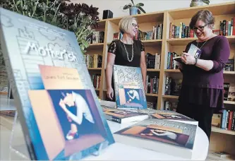  ?? CLIFFORD SKARSTEDT/EXAMINER ?? Author Laura Rock Gaughan, right, signs copies of her new book Motherish for Amanda English on Sept. 13 at Hunter Street Books.