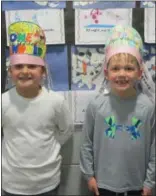  ?? SUBMITTED BY WENDY LEDFORD ?? Kindergart­en students at Schwenksvi­lle Elementary celebrated the day with many fun learning activities. Michael Beidler and Jonathan Chalmers in Mrs. Ame Tanski’s kindergart­en class wear their 100-day crowns.