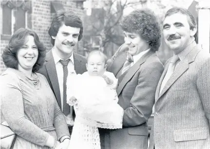  ??  ?? Right: Bryan Robson holds baby Andrew Walker, flanked by Everton’s John Barton and Andrew’s parents