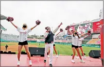  ?? (AP) ?? In this May 5, 2020 file photo, SK Wyverns’ cheerleade­rs cheer for their team during a baseball game against Hanwha Eagles in Incheon, South
Korea.