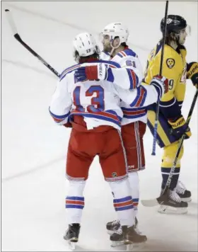  ?? MARK HUMPHREY — ASSOCIATED PRESS ?? New York Rangers left wing Rick Nash (61) celebrates with right wing Kevin Hayes (13) after Nash scored a goal against the Nashville Predators in the game Saturday, in Nashville, Tenn.