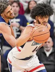  ?? Jessica Hill/Associated Press ?? UConn’s Andre Jackson Jr., right, steals the ball from Seton Hall’s Tray Jackson (1) in the second half on Saturday in Storrs.