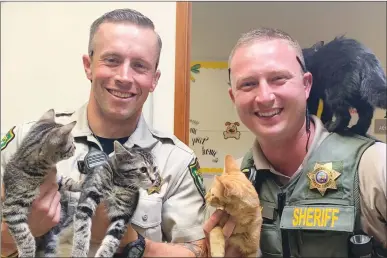  ?? Courtesy photo ?? Members of the Yuba County Sheriff’s Office pose with kittens at the Yuba County Animal Care Services facility during “Adopt a Shelter Pet Day” in 2020.