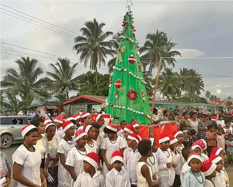  ?? ?? Christmas tree lighting at the main street of Navua Town on December 21, 2022.