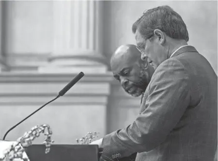  ?? NICOLE HESTER / THE TENNESSEAN ?? Rep. Harold Love Jr. speaks with House Speaker Cameron Sexton during a session while discussing a bill concerning the TSU board in Nashville on March 28.