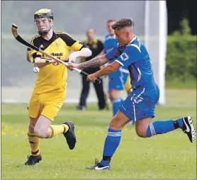  ?? Photograph: Stephen Lawson. ?? Inveraray’s Ruaraidh Graham Junior and Kilmallie’s Arron Sandison fight for the ball during last Saturday’s Camanachd Cup encounter at the Winterton which ended in a 0-0 draw.