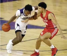  ?? Ap ?? OFF THE DRIBBLE: East Carolina’s Tristen Newton (2) tries to drive past Houston’s Quentin Grimes last night.