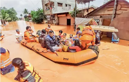  ?? - PTI ?? Rescue operation being carried out at a flood affected area in Kolhapur district on Saturday.