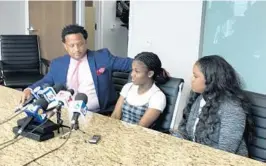  ?? PERKINS / SOUTH FLORIDA SUN SENTINEL CHRIS ?? Attorney Marwan Porter, 13-year-old Nia Whims, and Nia’s mother Lezlie-Ann Jones, at a Wednesday news conference where they announced a lawsuit over Nia’s arrest and detention on charges of threatenin­g a teacher, a former classmate, and a school. The former classmate has been arrested and accused of impersonat­ing Whims and making the threats.
