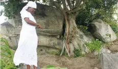  ??  ?? Mrs Gwiri shows off one of the graves that was exhumed on the land she was allocated under the Ushe Wokunze Cooperativ­e