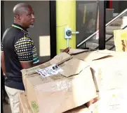  ?? ?? ANC provincial secretary Soviet Lekganyane has a look at the donated packages.