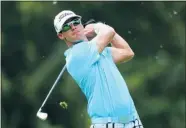  ?? Getty Images ?? Graham DeLaet hits his tee shot on the third hole during
the final round of the Greenbrier Classic on Sunday.