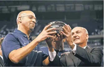  ?? BRIAN SPURLOCK, USA TODAY SPORTS ?? Penn State’s James Franklin, left, accepts the Big Ten football trophy from Jim Delany.