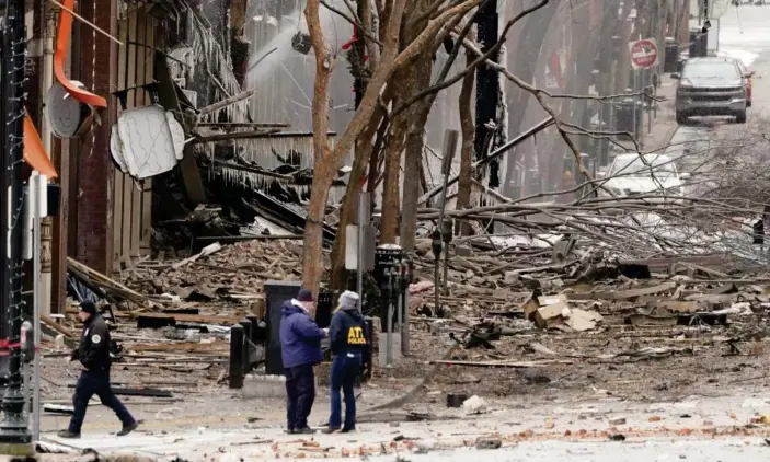  ?? Photograph: Mark Humphrey/AP ?? Emergency personnel work near the scene of an explosion in downtown Nashville, Tennessee, on Friday.