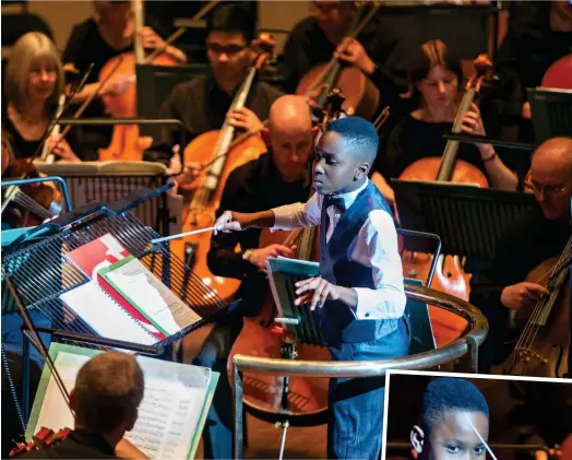  ??  ?? Mini maestro: Matthew Smith conducts last night. Inset: Taking his applause