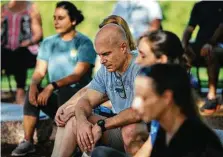  ?? Marie D. De Jesús / Staff photograph­er ?? People take part in the inaugural Mindful Morning on Saturday at Buffalo Bayou Park.