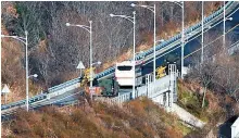  ?? Yonhap ?? A bus takes the Donghae Line survey team, consisting of South Korean government officials and railway experts, to North Korea to inspect the Donghae Line railway along the eastern coast, in this Dec. 8, 2018 file photo.