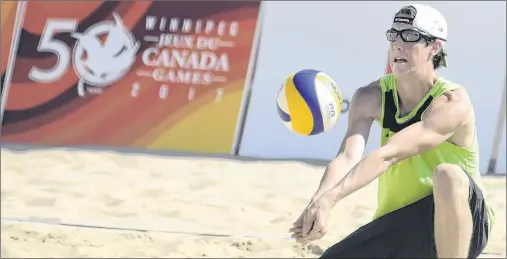  ?? JASON MALLOY/THE GUARDIAN ?? Summerside’s Ethan Boyd gets low to dig a ball during opening day action at the beach volleyball championsh­ip Sunday at the Canada Games in Winnipeg.