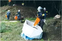  ??  ?? A MAN removes contaminat­ed soil in Japan, where people are still struggling with radioactiv­e water and other safety issues related to a tidal wave in 2007.