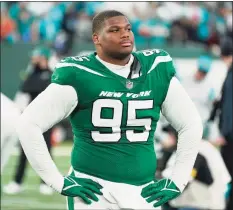  ?? Corey Sipkin / Associated Press ?? The Jets’ Quinnen Williams leaves the field after Sunday’s loss to the Dolphins in East Rutherford, N.J.