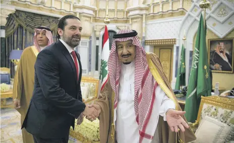  ?? Reuters ?? Saudi King Salman yesterday welcomes Lebanese Prime Minister Saad Al Hariri at Al Yamama palace in Riyadh