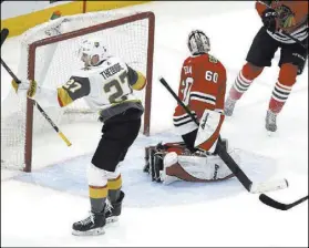  ?? Nuccio DiNuzzo The Associated Press ?? Golden Knights defenseman Shea Theodore celebrates his overtime goal past Chicago Blackhawks goaltender Collin Delia on Saturday in Chicago. The Knights won 4-3.