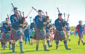  ?? Photo / Lisa Jones ?? Te Awamutu Highland Pipe Band leading the Gumboot Walk.