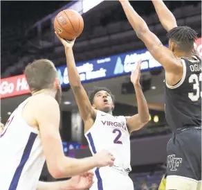  ?? ERIN EDGERTON/ASSOCIATED PRESS ?? Virginia freshman guard Reece Beekman scored a season-high 12 points in a 70-61 victory Wednesday against Wake Forest in Charlottes­ville.