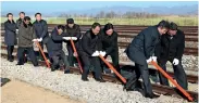  ?? — AP ?? South and North Korean officials at a groundbrea­king ceremony at Panmun Station in Kaesong on Wednesday.