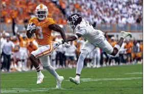  ?? (AP/Wade Payne) ?? Tennessee defensive back Dee Williams (3) runs past Texas A&M defensive back Jacoby Mathews (2) on a 39-yard punt return Saturday in Knoxville, Tenn. Williams’ score gave the Volunteers a 14-10 lead in the third quarter, one it would not yeild back to the Aggies in a 20-13 win.