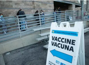  ?? Tribune News Service/los Angeles Times ?? Parents and children line up for COVID vaccine shots at Arleta High School on Nov. 8.