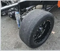  ??  ?? Sticky Hoosier DR2 tires rocket the truck down the dragstrip. The 325/40R18 drag radials mounted on Moto Metal wheels are responsibl­e for 60-foot times in the 1.30s, and Kenny runs the tires at an incredibly low 10psi in the rear and 15psi up front.