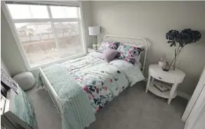  ??  ?? Another bedroom in the Oakmont show home in St. Albert. The townhomes’ square footages range from 1,094 to 1,704.