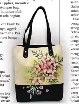  ??  ?? BEDA: Salah satu jenis tote bag yang dilukis dengan menggunaka­n cat air.