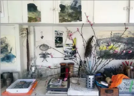 ?? LOUESA ROEBUCK VIA AP ?? This photo provided by artist Louesa Roebuck shows her work studio in Ojai Some of her monotype studies are seen. A few pieces by friends and creative growth artist also adorn the studio along with the peach blossoms.