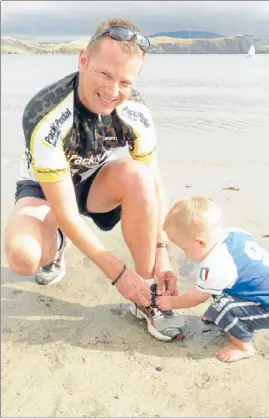  ??  ?? Lacing up: Matt Wood, with a little help on this occasion from 20-month-old son Samuel, is training hard ahead of the Porirua Grand Traverse on April 1. A recent melanoma scare has reaffirmed his reliance ‘‘on God, family and friends’’, he says.