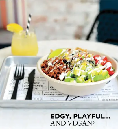  ??  ?? It’s no coincidenc­e that the quinoa taco salad (left) fits in perfectly with the interior design of by CHLOE. The color scheme was carefully chosen to compliment the spectrum of vegan fare.