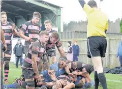  ??  ?? Second helpings Steven Longwell is at the base of a pile of bodies after scoring Ayr’s second try