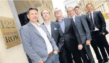  ??  ?? >
From left to right: Paul Jones, Evenacre; Stuart Pratt and Andrew Mitchell, Godwin Developmen­ts; Peter Fowles, Sanderson Weatherall; Harry Benson, Evenacre; and Theo Holmes, CBRE outside 122 Colmore Row in Birmingham