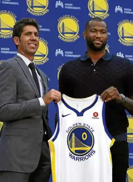  ?? —AP ?? Golden State Warriors general manager Bob Myers (left) unveils the team’s latest all-star player, DeMarcus Cousins.