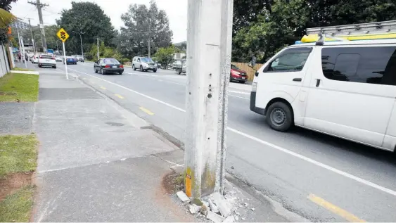  ?? Photo / Michael Cunningham ?? A power pole hit on Maunu Rd in a fatal car crash earlier this week. Remove the hazard by installing power lines undergroun­d, says John Williamson.