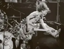  ?? Associated Press file photo ?? Eddie Van Halen plays the final chord of “Jump” during a 2004 Van Halen concert in New Jersey.