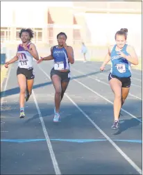  ?? PHOTO BY JERRY BALLENGEE ?? Leonardtow­n’s Katie Kelly, right, is out front in the 200-meter dash as Lackey’s Ebony Campbell and Breanna Perry of McDonough trail in Tuesday’s track meet at Lackey High School which also included Northern.