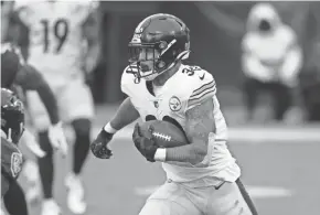  ?? NICK WASS/AP ?? Steelers running back James Conner carries against the Ravens on Sunday in Baltimore.