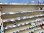  ??  ?? Empty shelves of hand gel in Sainsbury’s store