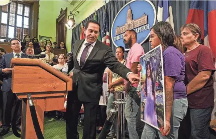  ?? MIKALA COMPTON/AUSTIN AMERICAN-STATESMAN ?? State Rep. Trey Martinez Fischer, D-San Antonio, points to a photo of Uvalde shooting victim Amerie Jo Garza during a May 8 news conference at the Texas Capitol as victims’ families call for gun law reform.